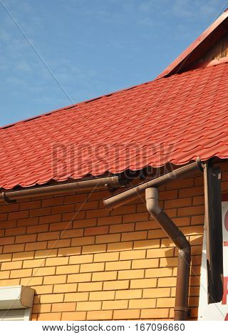 Rain gutter ice dams. Broken Rain Gutters and Downspout Drainepipe.