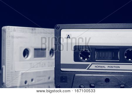 Audio cassette old tape on the glass surface.
