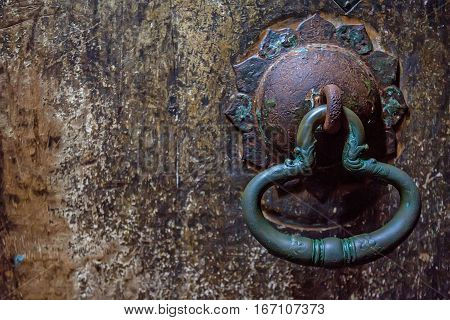 Antient door handle at gates of cave temple in Dambulla, Sri Lanka