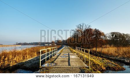 Small bridge over a creek. Frosty morning.