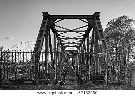 closed entrance to the railway tracks on the bridge