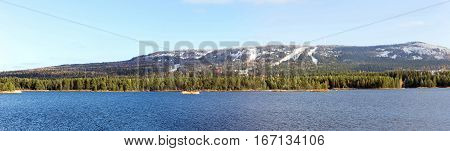 Large-format panorama of the Ural mountains and blue lake