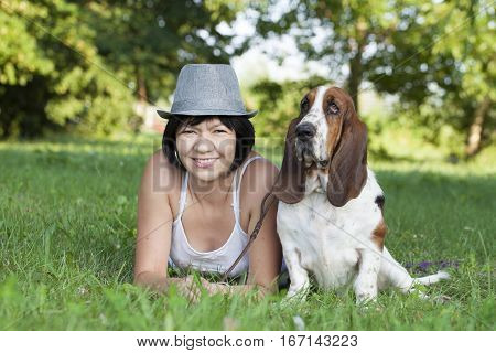 The woman with a dog in the park Selective focus and small depth of field lens flare