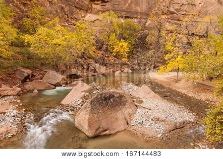 a scenic landscape of the Virgin River in fall in Zion National Park Utah