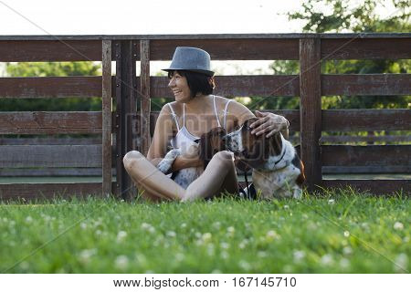 The woman with the dogs in the countryside Selective focus and small depth of field lens flare