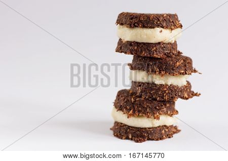 Photo of cookies made from healthy ingredients that are acceptable in raw vegan and paleo lifestyle. Image on the white background.