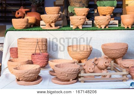 Display the group of decoreted craft clay bowl