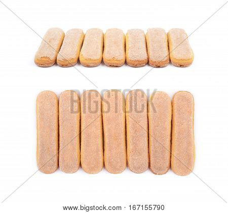 Ladyfinger savoiardi biscuit cookies lined up, composition isolated over the white background, set of two different foreshortenings