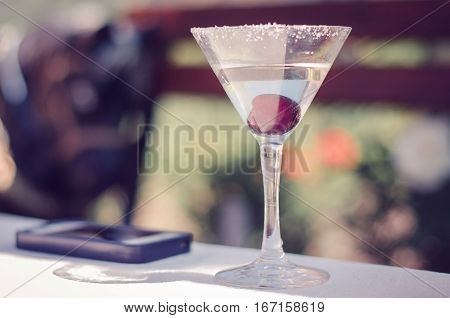 Martini cherry cocktail drink and glass on the table