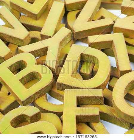 Surface coated with the multiple painted wooden block letters as an abstract backrop composition
