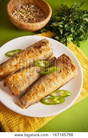 fried shad with chilli australian fish on green