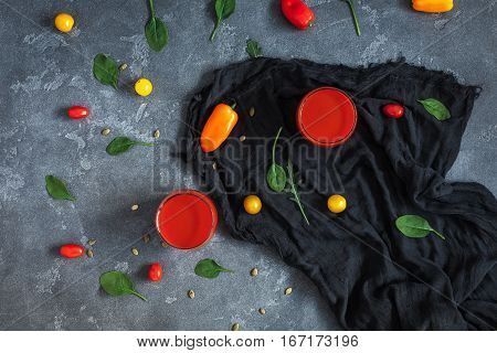 Fresh vegetable juice on stone bsckground. Flat lay top view
