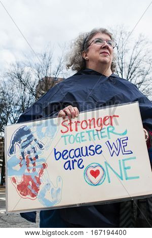 ATLANTA, GA - JANUARY 2017:  A woman holds a sign that says 