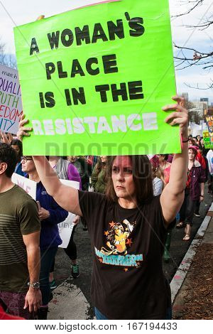 ATLANTA, GA - JANUARY 2017:  A woman carries sign that says 