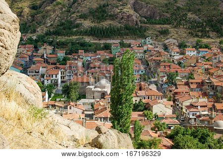 Colorful traditional ottoman houses and a mosque in the old town center of Afyon Turkey
