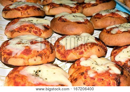 small pizza with tomato sauce and cheese