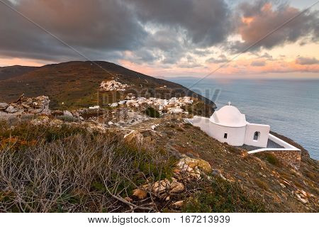 Church over village of Kastro on Sikinos island early in the morning.