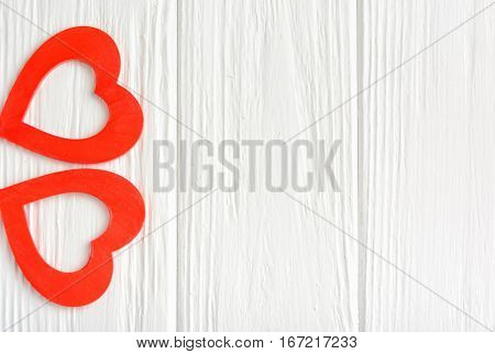 White background with two red hearts for a congratulation Happy Valentine's Day. Top view