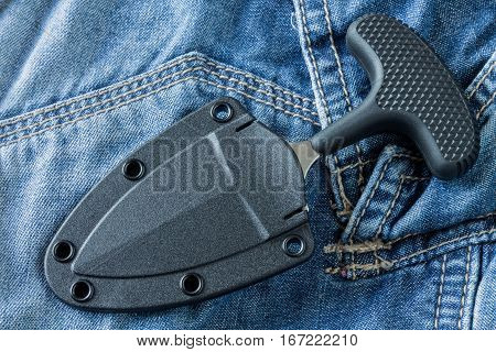 Urban Knife In Case On Jeans Background. Diagonal Position.