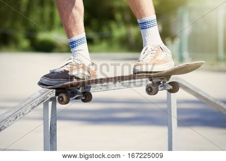 Skater Doing Noseslide On Fun-box In Skatepark
