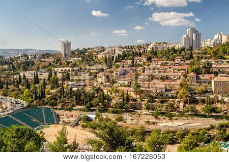 View of Jerusalem and historic neighborhood Yemin Moshe from the wall of the Old City in Jerusalem Israel