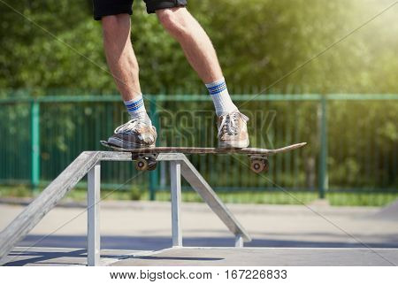 Skater Doing Tailside On Fun-box In Skatepark