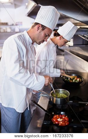 Chef preparing food in the kitchen of a restaurant