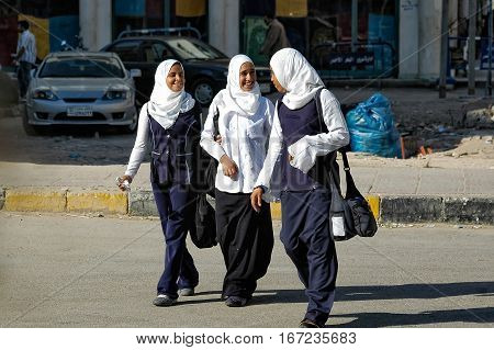 Hurghada, Egypt - November 7. 2006: Schoolgirls of the senior classes come back home from school