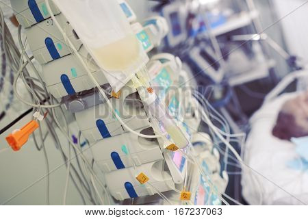 Transfusion of blood components to a patient in critical condition.