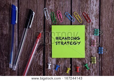 Tolls With Notes BRANDING STRATEGY Conceptual On Wooden Background
