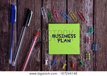 Tolls With Notes BUSINESS PLAN Conceptual On Wooden Background