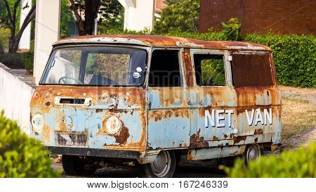 Rusted carcass of old abandoned Net Van.Thailand