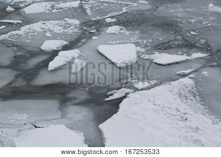 Frozen River With Accumulated Drift Ice Putting Preasure On Docks And Boats