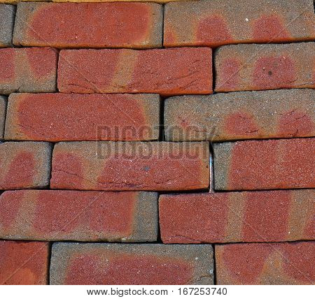 Pointing Brick Wall Copy Space. Bright Studio Closeup on Colorful Red Old Luxury Ceramic Clinker Brick Textured Wall Background with Copyspace.