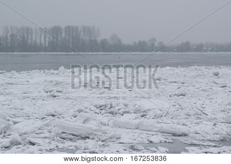 Frozen River With Accumulated Drift Ice Putting Preasure On Docks And Boats