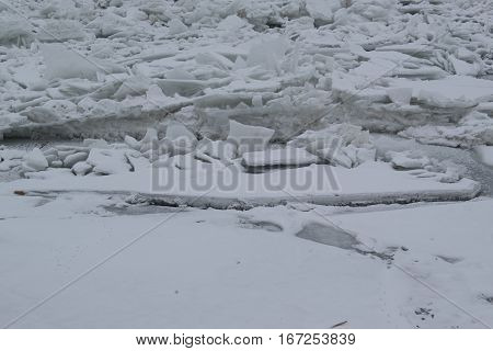 Frozen River With Accumulated Drift Ice Putting Preasure On Docks And Boats