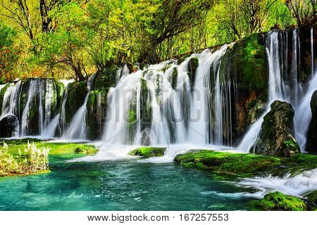 Amazing Waterfall And Azure Lake With Crystal Clear Water
