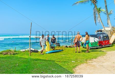 AHANGAMA SRI LANKA - DECEMBER 3 2016: The local beach is popular among surfers and local fishermen on December 3 in Ahangama.