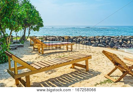 The Wooden Chaise Lounges