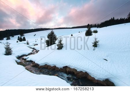 winter sunset in mountains Black forest Germany