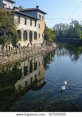 Country house along the Naviglio Grande of Turbigo (Milan Lombardy Italy) at fall with geese