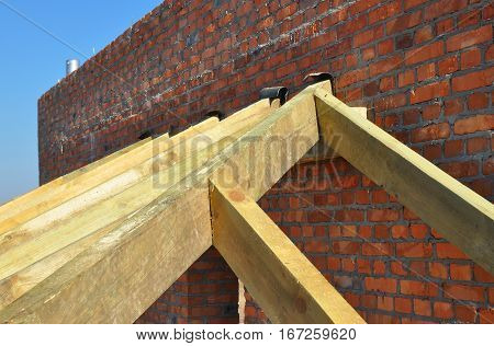 Building timber roof trusses for new attic house construction. Timber roof truss. Roofing construction.