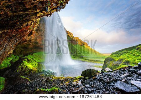 Sunrise on Seljalandfoss waterfall on Seljalandsa river, Iceland, Europe.