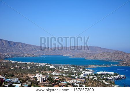 Elevated view of Elounda with views across the sea towards the island of Spinalonga on the right hand side Elounda Crete Greece Europe.