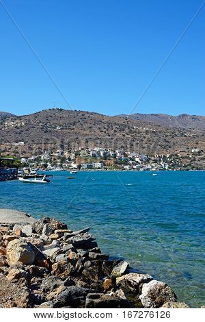 ELOUNDA, CRETE - SEPTEMBER 17, 2016 - View across the bay towards the coastline with the rocky shoreline in the foreground Elounda Crete Greece Europe, September 17, 2016.