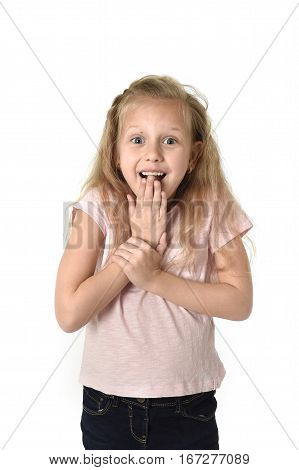 portrait of cute and sweet little girl in disbelief and surprise face expression looking amazed in schock with mouth opened isolated on white background