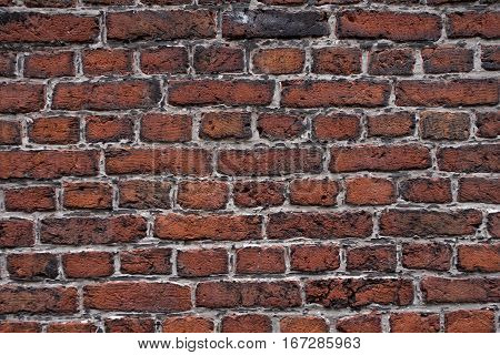 Colorful brick wall texture background. Between the bricks has a light mortar