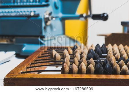 Old Calculating Machine On A Wooden Table