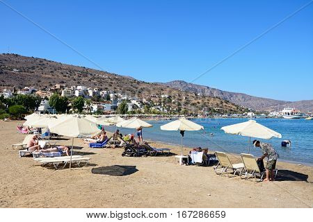ELOUNDA, CRETE - SEPTEMBER 17, 2016 - Tourists relaxing on the beach Elounda Crete Greece Europe, September 17, 2016.