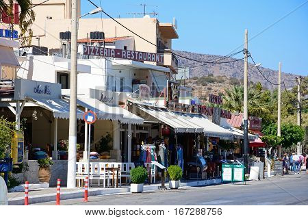 ELOUNDA, CRETE - SEPTEMBER 17, 2016 - Row of tourists shops in the harbour area Elounda Crete Greece Europe, September 17, 2016.